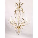 A SMALL GILT METAL AND CUT GLASS THREE BRANCH CHANDELIER. 1ft 10ins high x 1ft 2ins wide.