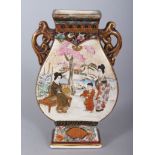 A JAPANESE SATSUMA SHAPED TWO-HANDLED VASE, painted with reverse panels of figures. 5ins high.