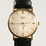 A GENTLEMAN'S LONGINES GOLD WRISTWATCH, with leather strap.