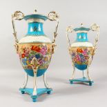 A PAIR OF SEVRES DESIGN TWO-HANDLED BLUE VASES AND COVERS, the borders painted with a band of