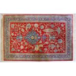 A GOOD PERSIAN PART SILK CARPET, with central motif, phoenix birds and flowers, within a triple