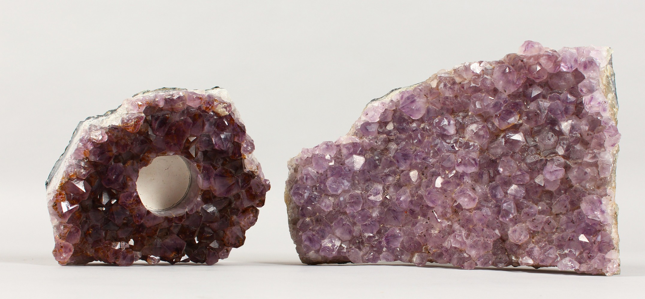 TWO AMETHYST CRYSTAL FRAGMENTS. 9ins wide and smaller.