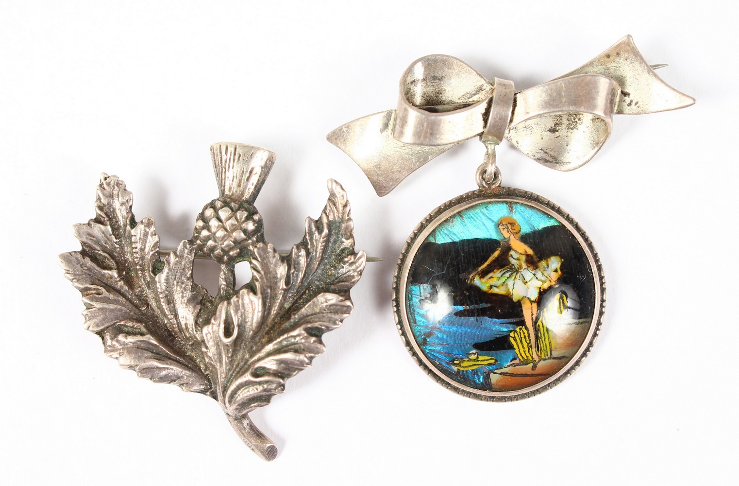 A SCOTTISH SILVER THISTLE BROOCH and A BUTTERFLY WING BROOCH (2).