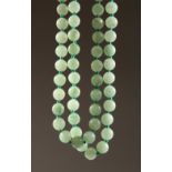 A JADE BEAD NECKLACE. 15.5ins long.