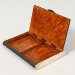 A WOODEN CIGARETTE CASE by ALFRED DUNHILL. 5.5ins.