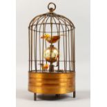 A SINGING BIRDCAGE CLOCK. 7ins high.