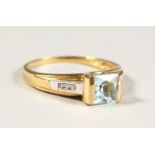 AN 9CT GOLD, AQUAMARINE AND DIAMOND RING.