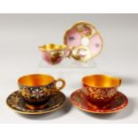 A SMALL PAIR OF COALPORT CUPS AND SAUCERS and A SEVRES CUP AND SAUCER.