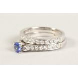 AN 18CT WHITE GOLD, TANZANITE AND DIAMOND RING and MATCHING HALF ETERNITY RING (2).