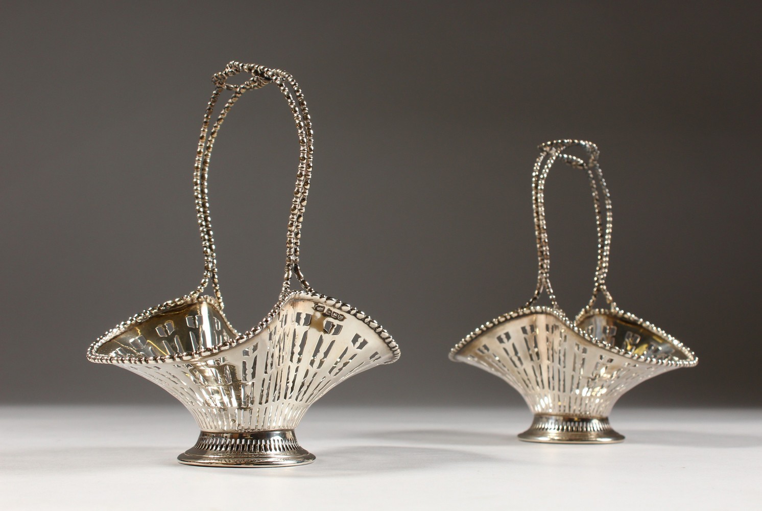 A PAIR OF PIERCED BASKETS (AF). Sheffield 1914.