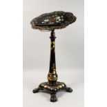 A GOOD VICTORIAN PAPIER MACHE, MOTHER-OF-PEARL AND GILDED ADJUSTABLE READING TABLE, the shaped top