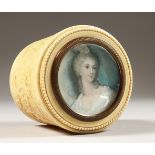 A GOOD CIRCULAR IVORY BOX, the lid with a portrait of a young lady. 2ins diameter.
