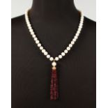 A SILVER GOLD PLATED, RUBY AND PEAR TASSEL NECKLACE.