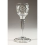 A GOOD GEORGIAN WINE GLASS, the bowl engraved with fruiting vines with raised foot. 6ins high.