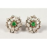 A GOOD PAIR OF DIAMOND AND EMERALD CLUSTER EARRINGS.