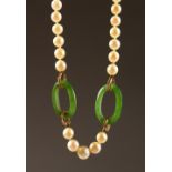 A CHINESE PEARL AND JADE NECKLACE, with gold clasp. 8ins long.