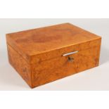 AN ALFRED DUNHILL BURR WOOD HUMIDOR. 10ins wide.