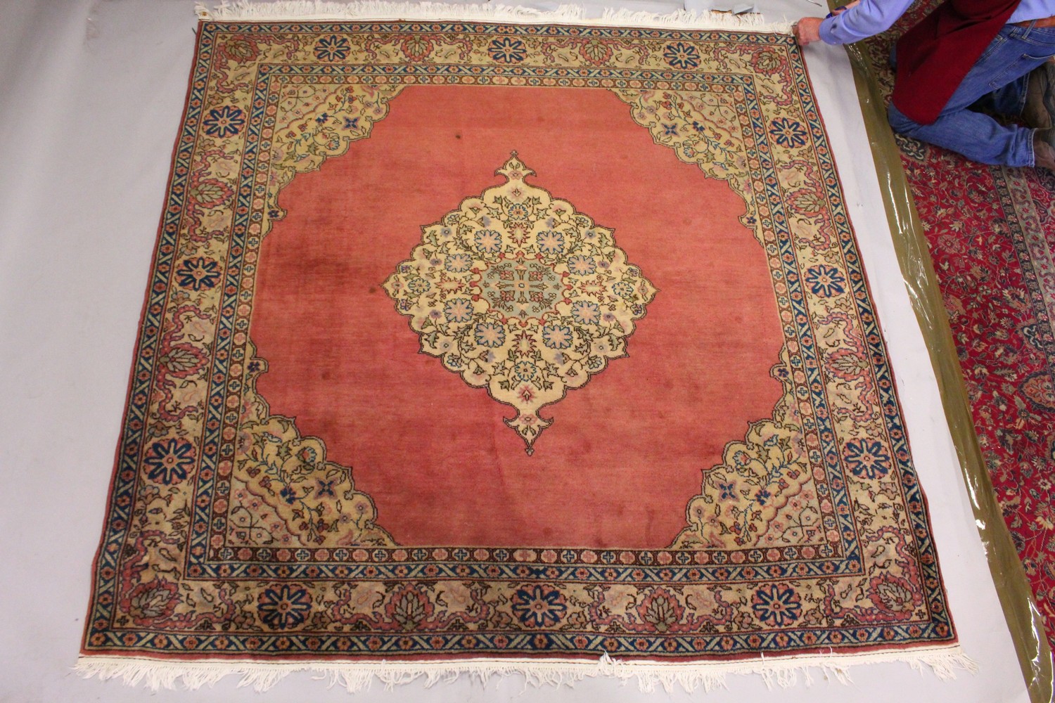 A PERSIAN CARPET, with rose ground, central motif, motifs to the border. 7ft 2ins x 7ft 4ins. - Image 2 of 10