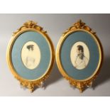 A PAIR OF WATERCOLOUR OVAL PORTRAITS, half length of a lady and gentleman, framed and glazed in gilt