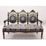 A VICTORIAN EBONISED FIVE PIECE SALON SUITE, comprising three seater settee, pair of armchairs and a