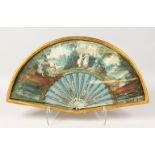 AN 18TH CENTURY FRENCH FAN, in a glazed gilt frame, classical figures in a garden setting. 20ins