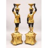 A LARGE PAIR OF GILDED BLACKAMOOR STANDS, with female figures holding bowls on their heads. 4ft 5ins