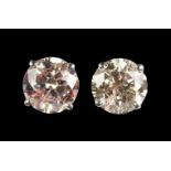 A PAIR OF WHITE GOLD LARGE DIAMOND SINGLE STONE STUD EARRINGS of 2.2cts.