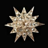 A DIAMOND STAR BROOCH.