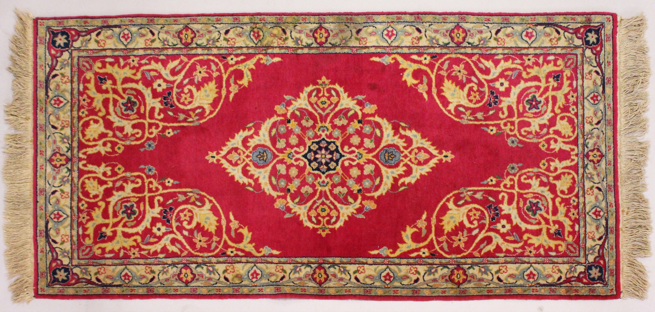 A PERSIAN RUNNER RUG, with central ground, on a rose ground. 6ft 5ins x 3ft.