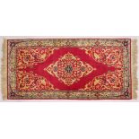 A PERSIAN RUNNER RUG, with central ground, on a rose ground. 6ft 5ins x 3ft.