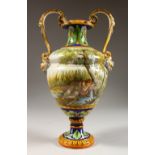 AN ITALIAN TWO-HANDLED URN SHAPED VASE, with mask handle, the body painted with reverse scenes of