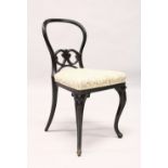 A VICTORIAN EBONISED BALLOON BACK DINING CHAIR.