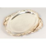 A PAIR OF OVAL SERVING TRAYS, with ornate cast borders. 22.5ins long.