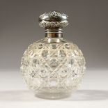 A GLOBULAR CUT GLASS SCENT BOTTLE, with silver stopper.