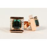 A PAIR OF 14CT ROSE GOLD EMERALD CUT GREEN TOURMALINE EAR STUDS.