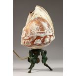 A VERY GOOD CARVED CAMEO SHELL TABLE LAMP, mounted as an ornate metal stand. 9ins high.