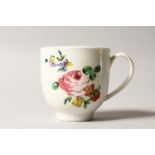 AN 18TH CENTURY BRISTOL COFFEE CUP painted in green with a rose and scattered flowers.