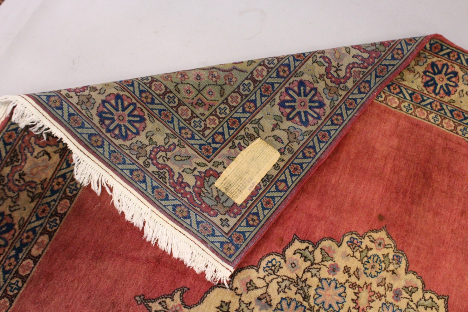 A PERSIAN CARPET, with rose ground, central motif, motifs to the border. 7ft 2ins x 7ft 4ins. - Image 6 of 10