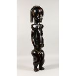 A LARGE FANG TRIBE SEATED FIGURE. 27ins high.