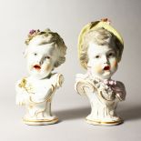 A GOOD PAIR OF 19TH CENTURY MEISSEN STYLE BUSTS OF CHILDREN, one with grapes in her hair, the