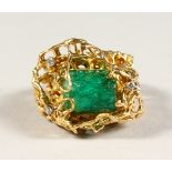 AN 18CT GOLD NATURAL EMERALD AND DIAMOND RING in the style of Grima