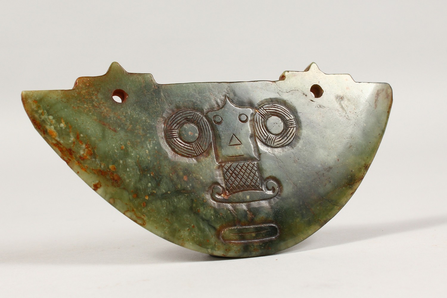 A LIANGZHU CULTURE JADE HUANG PENDANT, with incised decoration. 6ins wide.