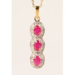 A 9CT GOLD, RUBY AND DIAMOND PENDANT AND CHAIN.