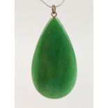 A GREEN JADE TIER DROP PENDANT.