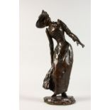 MAX LEVI A GOOD BRONZE OF A LADY in a long dress, which she is lifting out of the water. Signed