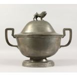 A LARGE 19TH CENTURY TWIN-HANDLED OVAL TUREEN AND COVER, with lion finial. 19ins wide.