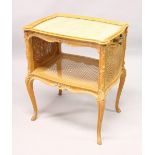 A FRENCH BEECH "TRAY TOP" BERGERE BEDSIDE TABLE, with needlework panel, cane work drop down sides,