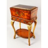 A GOOD 19TH CENTURY AND LATER MAHOGANY, PAINTED AND GILDED TEAPOY, with carved and gilded legs,