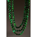A VERY GOOD TRIPLE ROW JADE NECKLACE, with 18ct gold clasp.