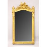 A GOOD 19TH CENTURY GILT FRAMED PIER MIRROR, with carved decoration, floral swags and classical